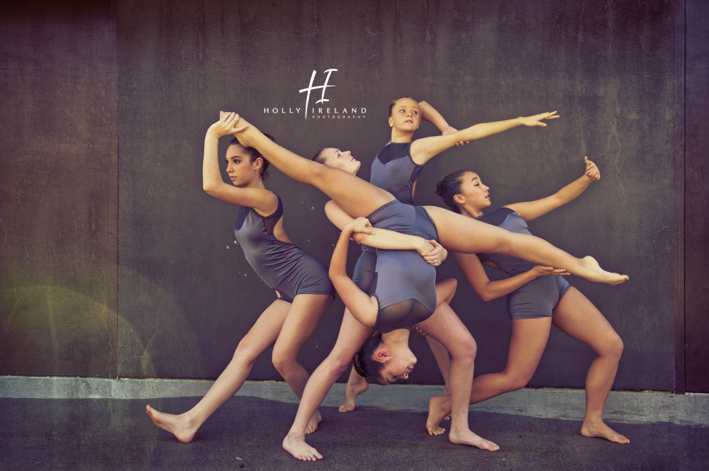 Premium Photo | Group of young girls ballet dancers performing posing  isolated over grey studio background giving